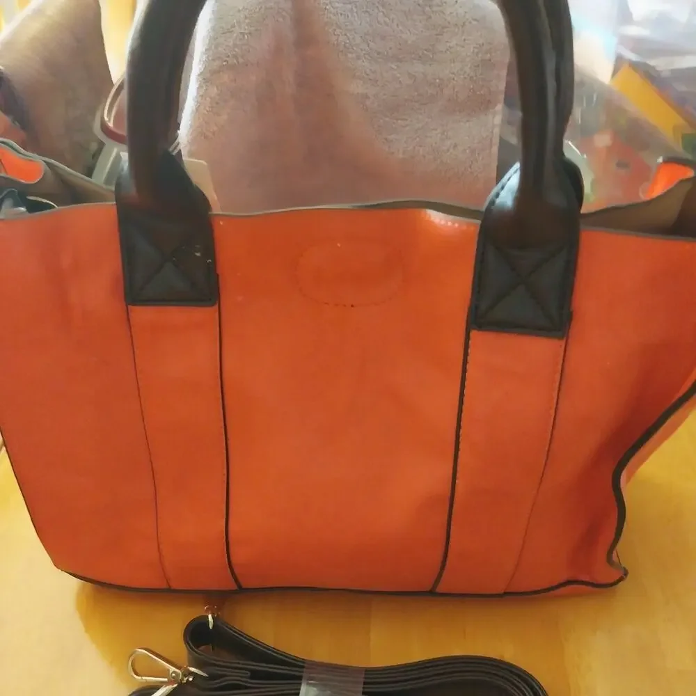 Charming Charlie Orange and Black Studded Satchel